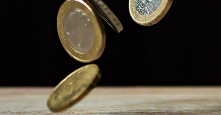 Economy - Coins on Brown Wood