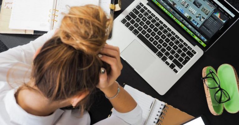 Workplace - Woman Sitting in Front of Macbook