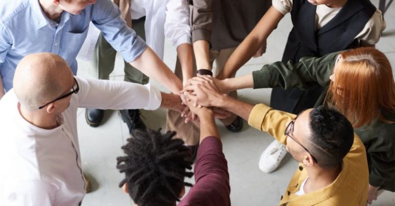Workplace - Photo Of People Holding Each Other's Hands