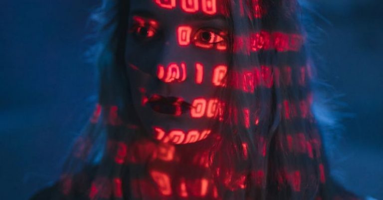 Cybersecurity Measures - Woman With Red Light On Face